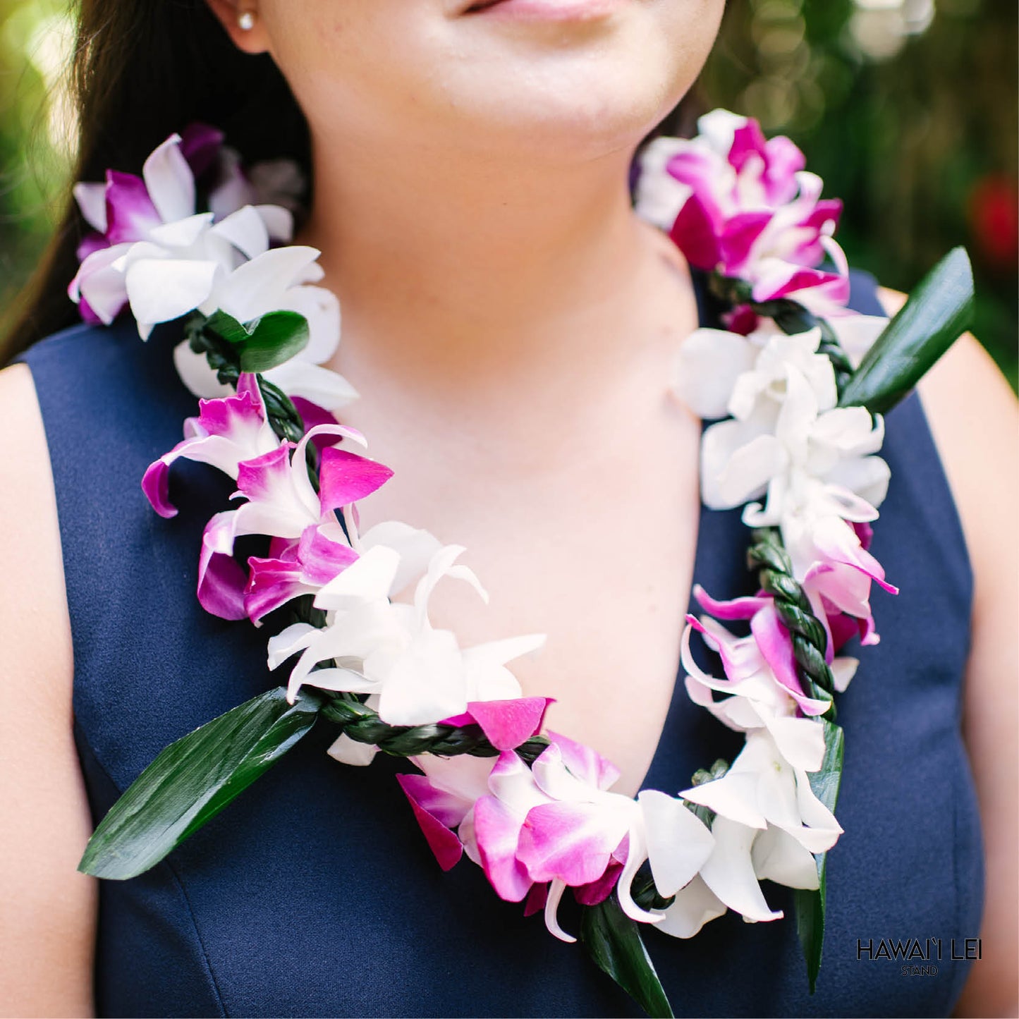 Orchid Wrapped With Ti Leaf Lei (Purple And White)