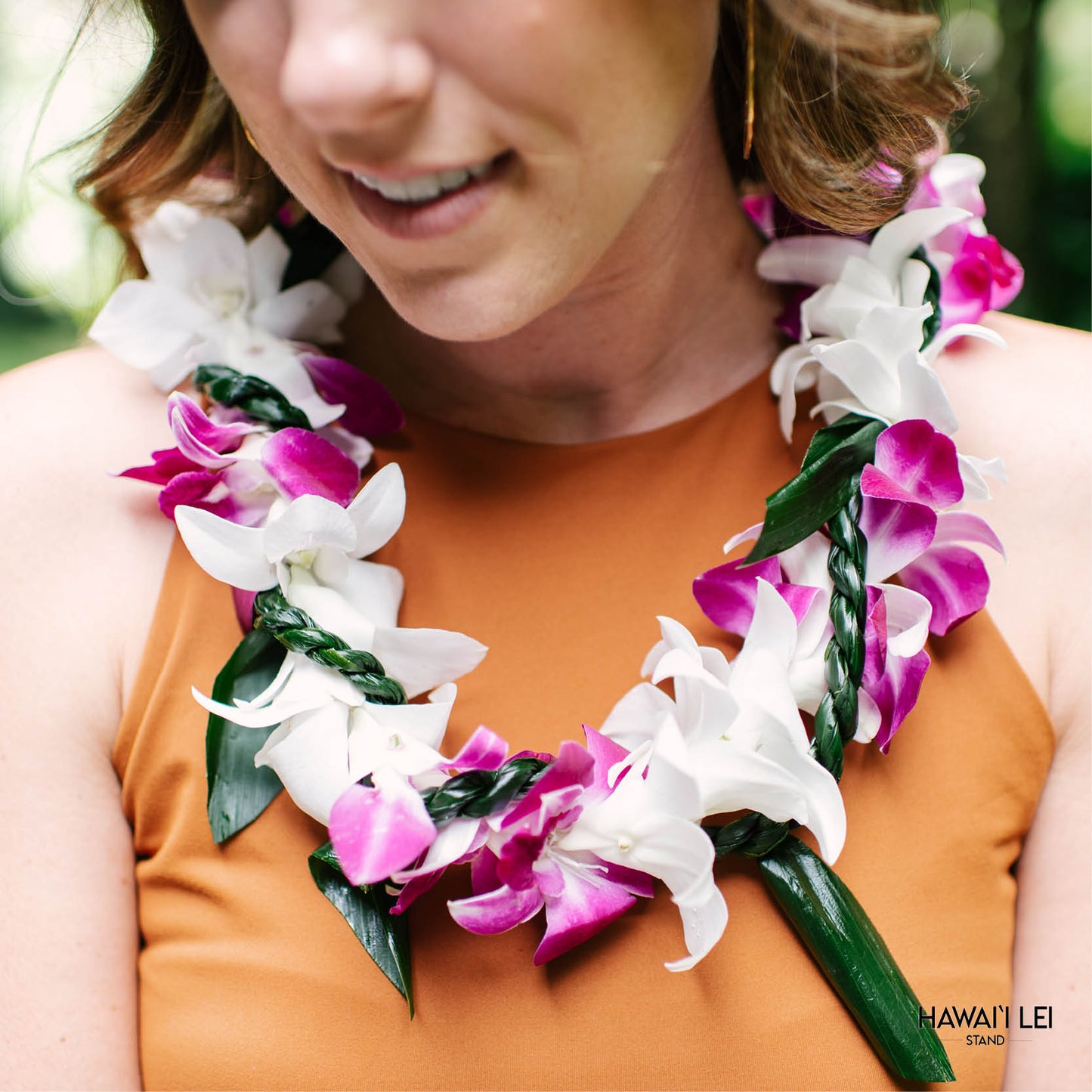 Orchid Wrapped With Ti Leaf Lei (Purple And White)